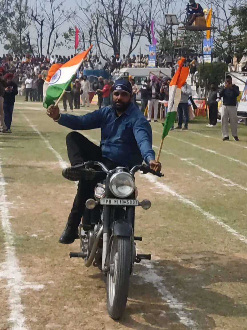 Photo by 1000 Things In Ludhiana on February 18, 2026. May be an image of motorcycle, flag and text.