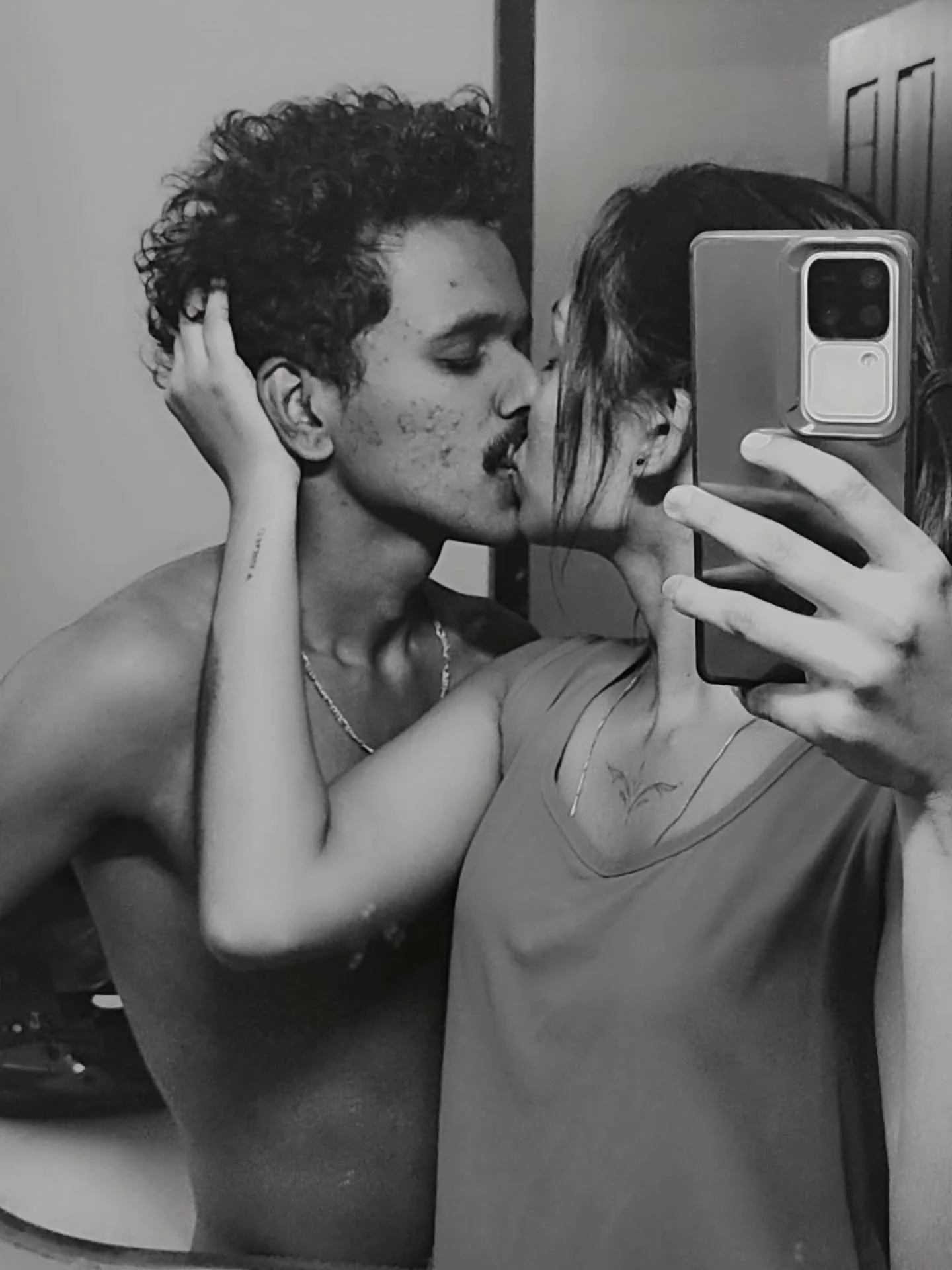 Photo by Jyothi🎀 on February 15, 2026. May be a black-and-white image of one or more people, hair, people kissing, mirror and text.