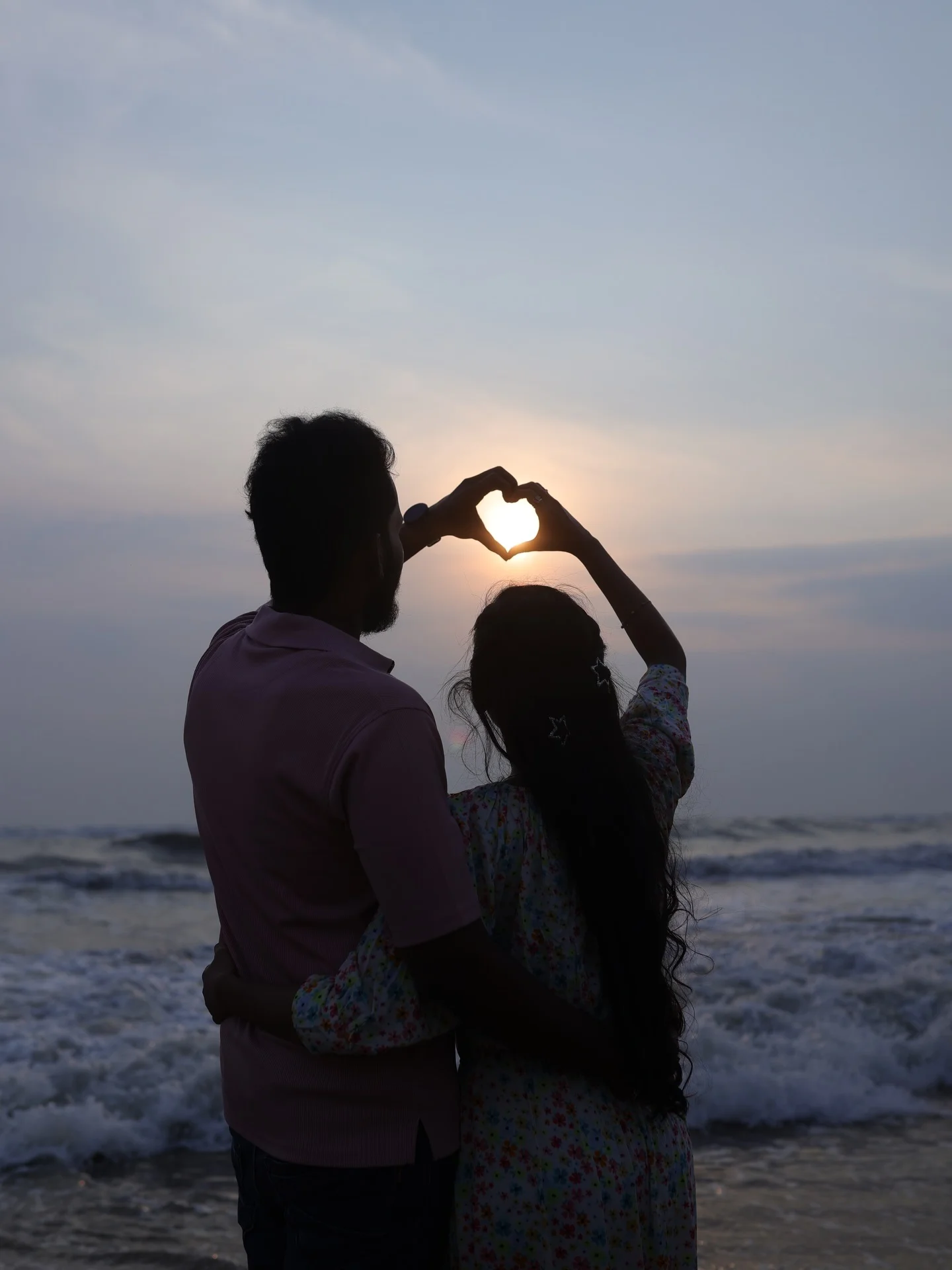 Photo by Nandhu_jeevs on February 16, 2026. May be an image of one or more people, people kissing, heart, ocean, beach, horizon and text.