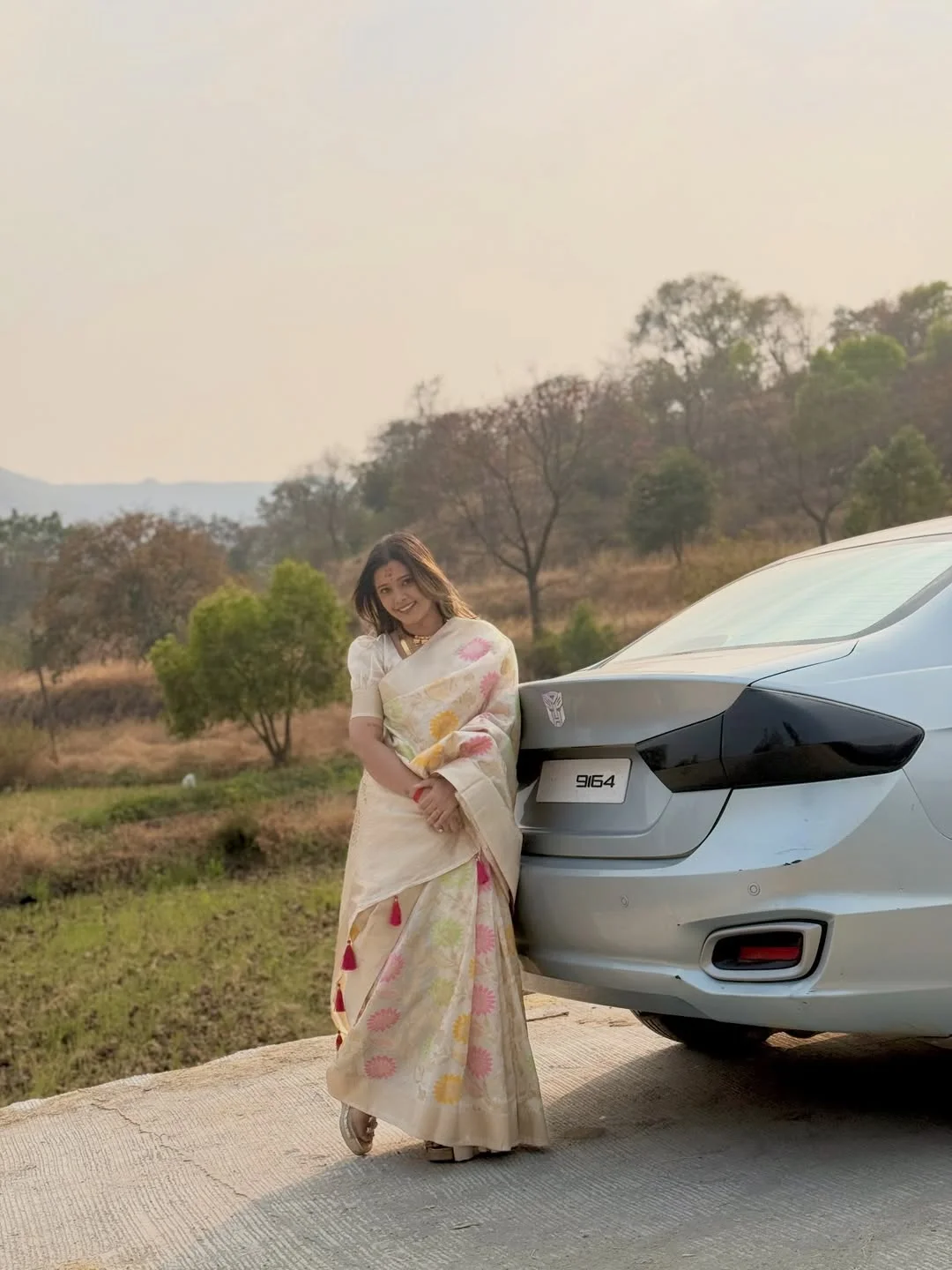 Photo shared by Aarti on February 17, 2026 tagging @_official_aartithorve29_, and @aarti_thorve29. May be an image of car, road, picnic and text.