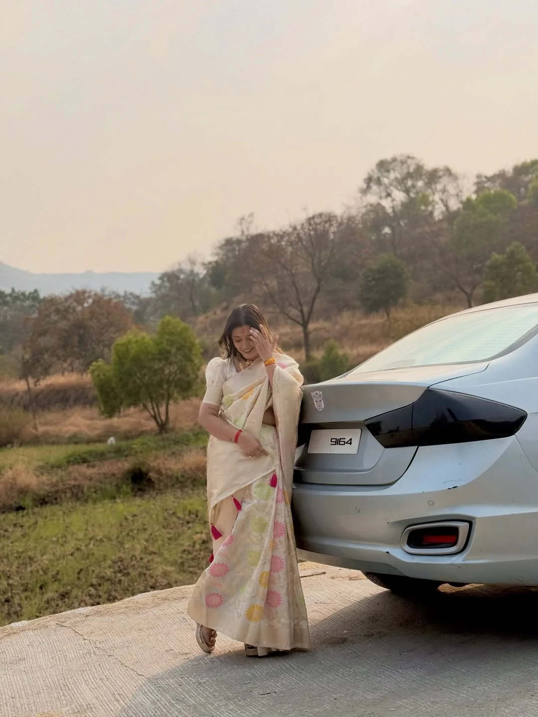 Photo shared by Aarti on February 17, 2026 tagging @aarti_thorve29. May be an image of car, road, park, picnic and text.