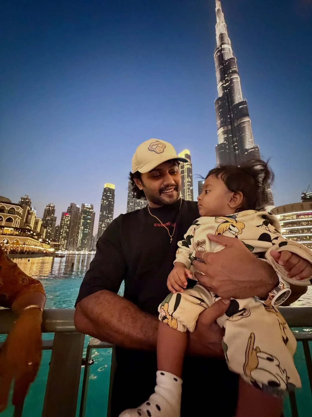 Photo by Avinash Ashok on February 18, 2026. May be an image of baby, skyscraper, tower, night and text.