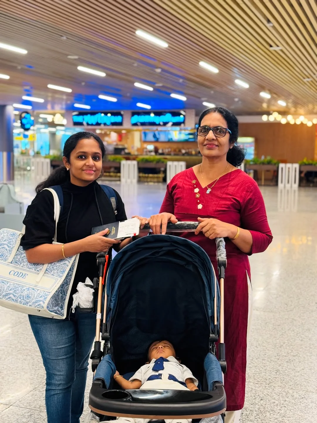 Photo by Avinash Ashok on February 15, 2026. May be an image of baby, suitcase, sling, luggage, terminal and text.