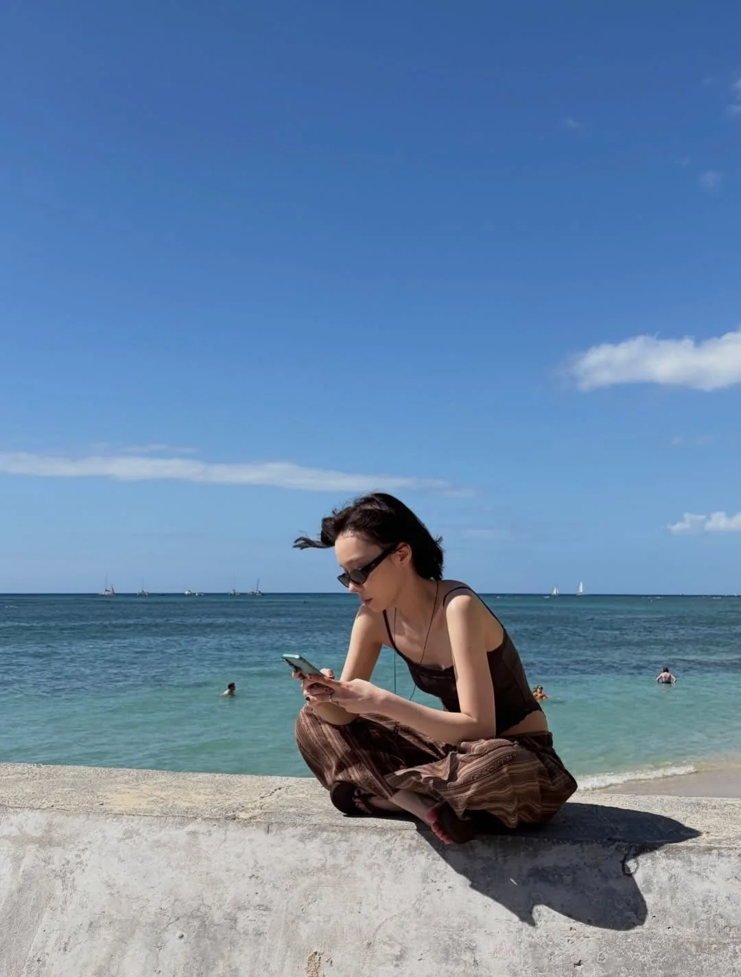 Photo by aespa 에스파 FANPAGE on February 19, 2026. May be an image of ocean, beach, horizon and text.