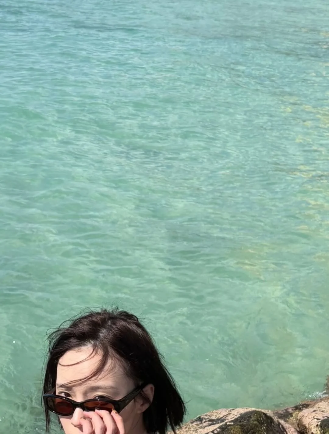 Photo by aespa 에스파 FANPAGE on February 19, 2026. May be an image of swimming, ocean, beach and text.