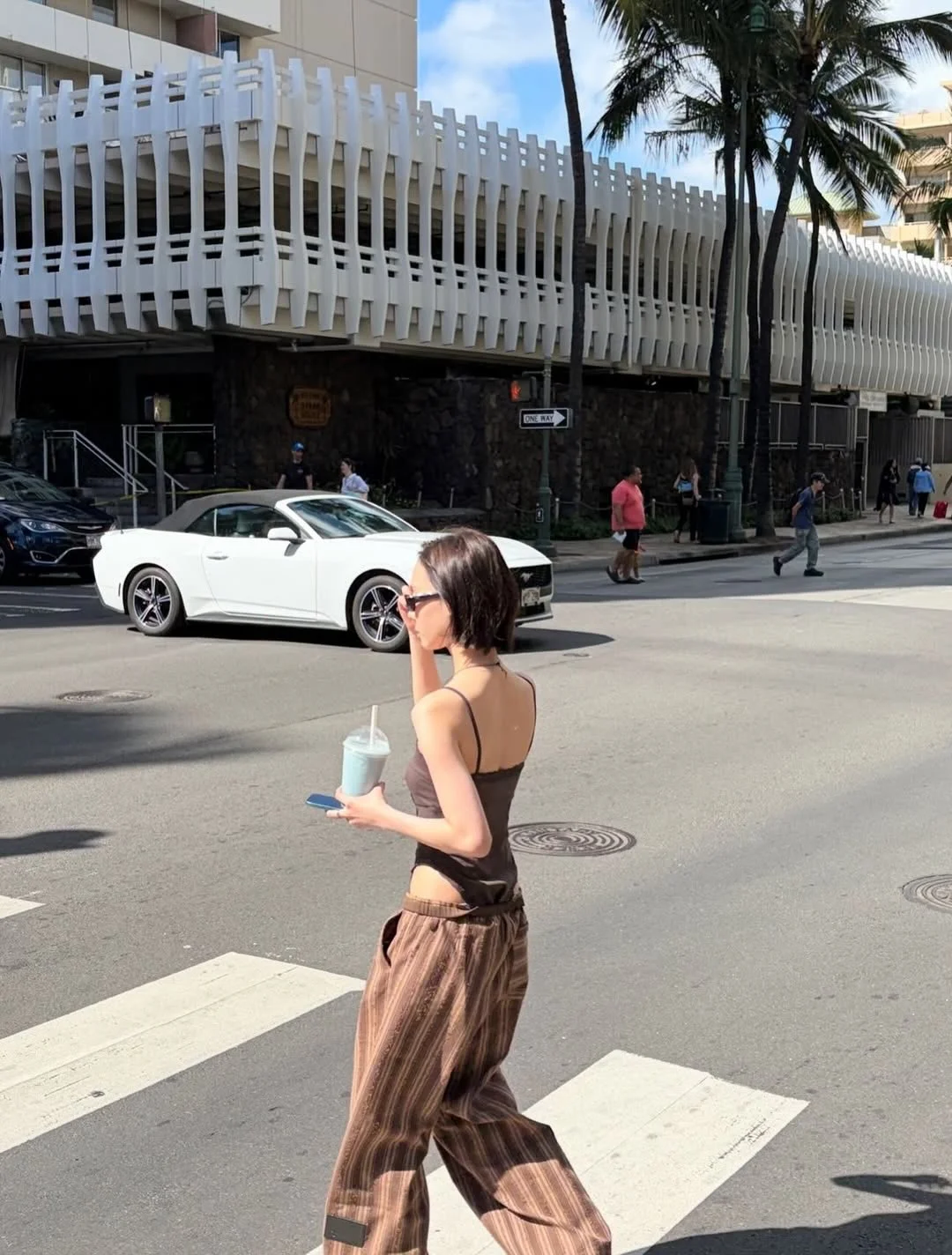 Photo by aespa 에스파 FANPAGE on February 19, 2026. May be an image of sarong, street and text.