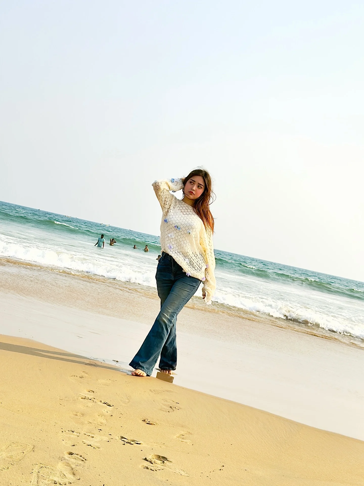 Photo by Aimi Gogoi on February 15, 2026. May be an image of standing, ocean, water, beach, horizon, coast and text.