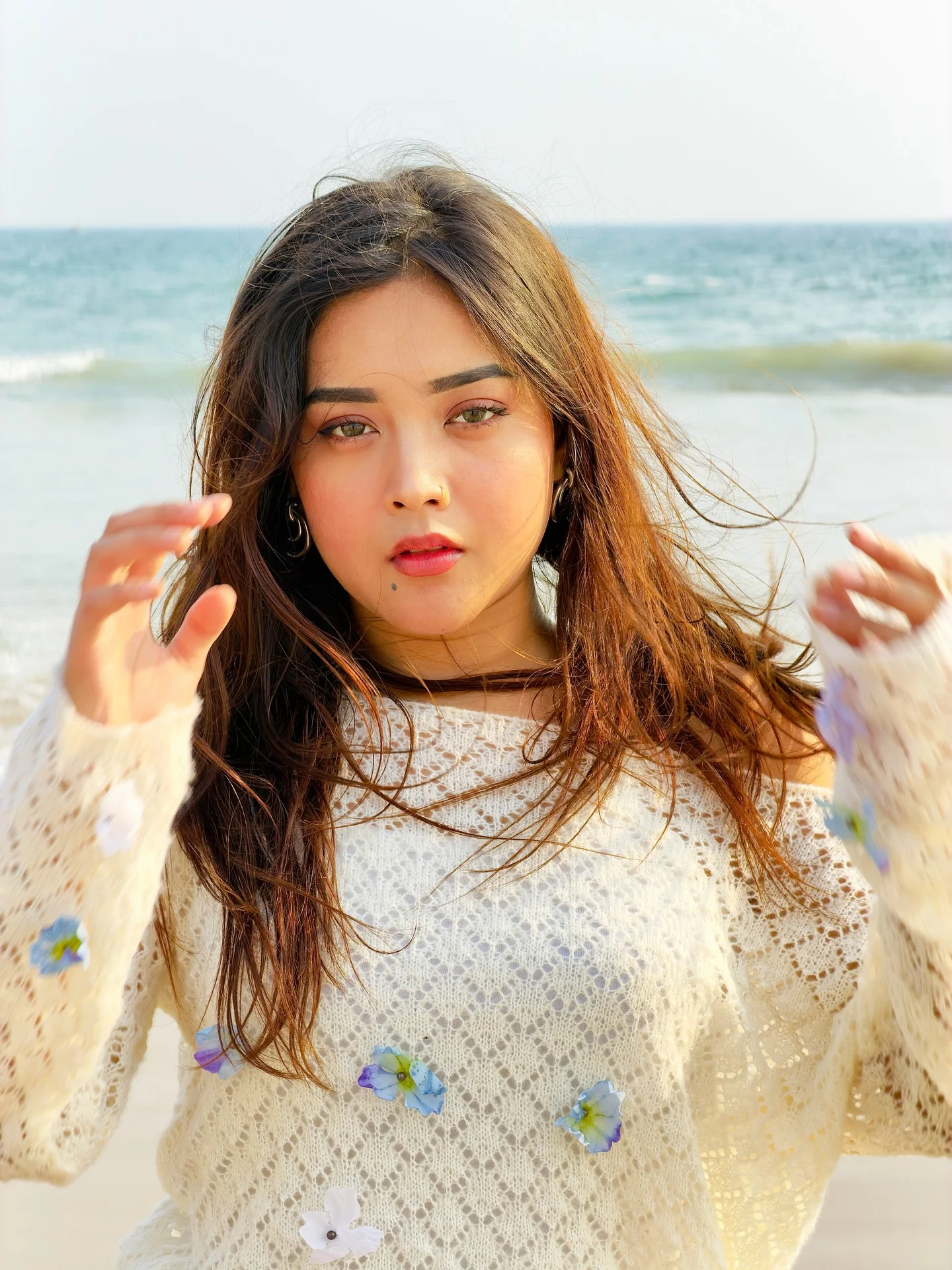 Photo by Aimi Gogoi on February 15, 2026. May be an image of one or more people, hair, makeup, top, beach and text.