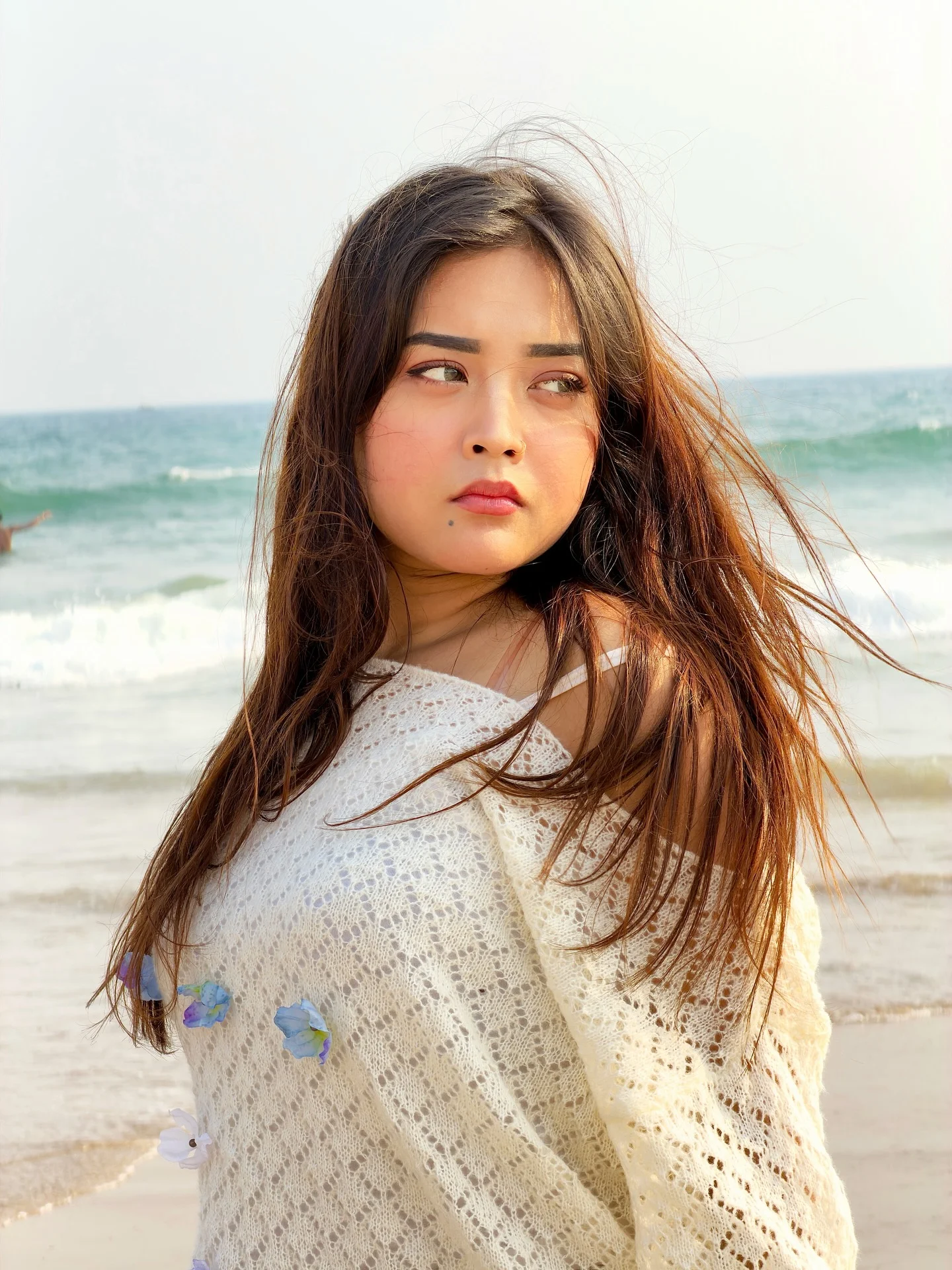 Photo by Aimi Gogoi on February 15, 2026. May be an image of one or more people, braids, makeup, beach and text.