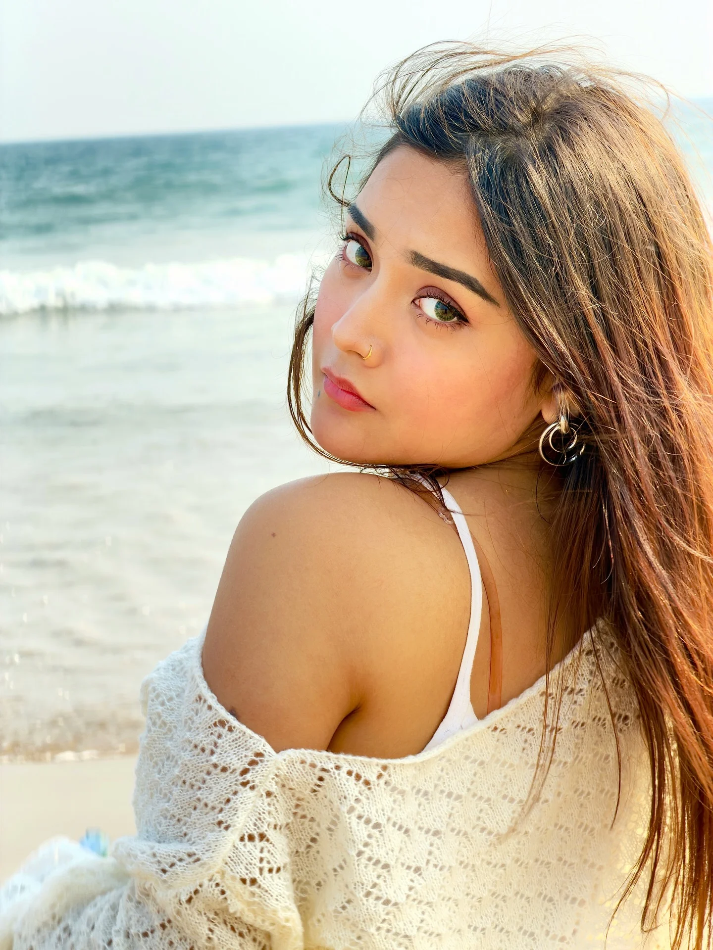 Photo shared by Aimi Gogoi on February 15, 2026 tagging @aimi2.0_, and @aimiggi. May be an image of one or more people, makeup, hair, people smiling, beach and text.