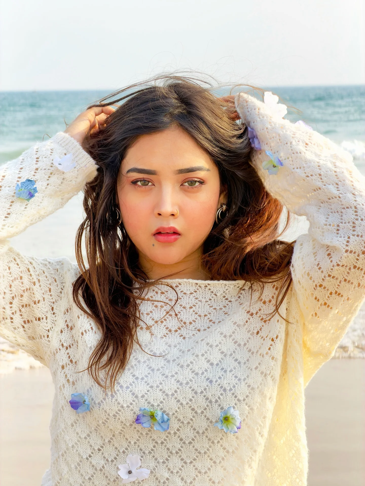 Photo by Aimi Gogoi on February 15, 2026. May be an image of one or more people, braids, makeup, top, beach and text.