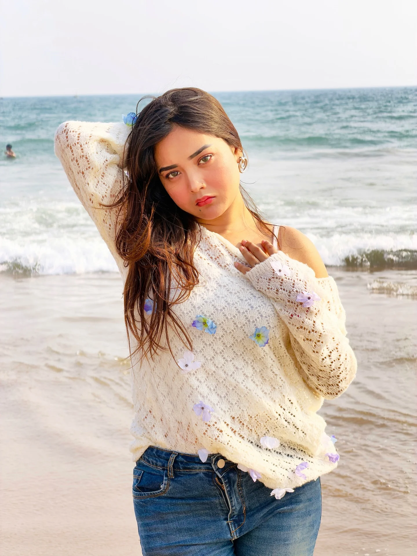 Photo by Aimi Gogoi on February 15, 2026. May be an image of one or more people, makeup, fishnet stockings, beach, water, ocean and text.