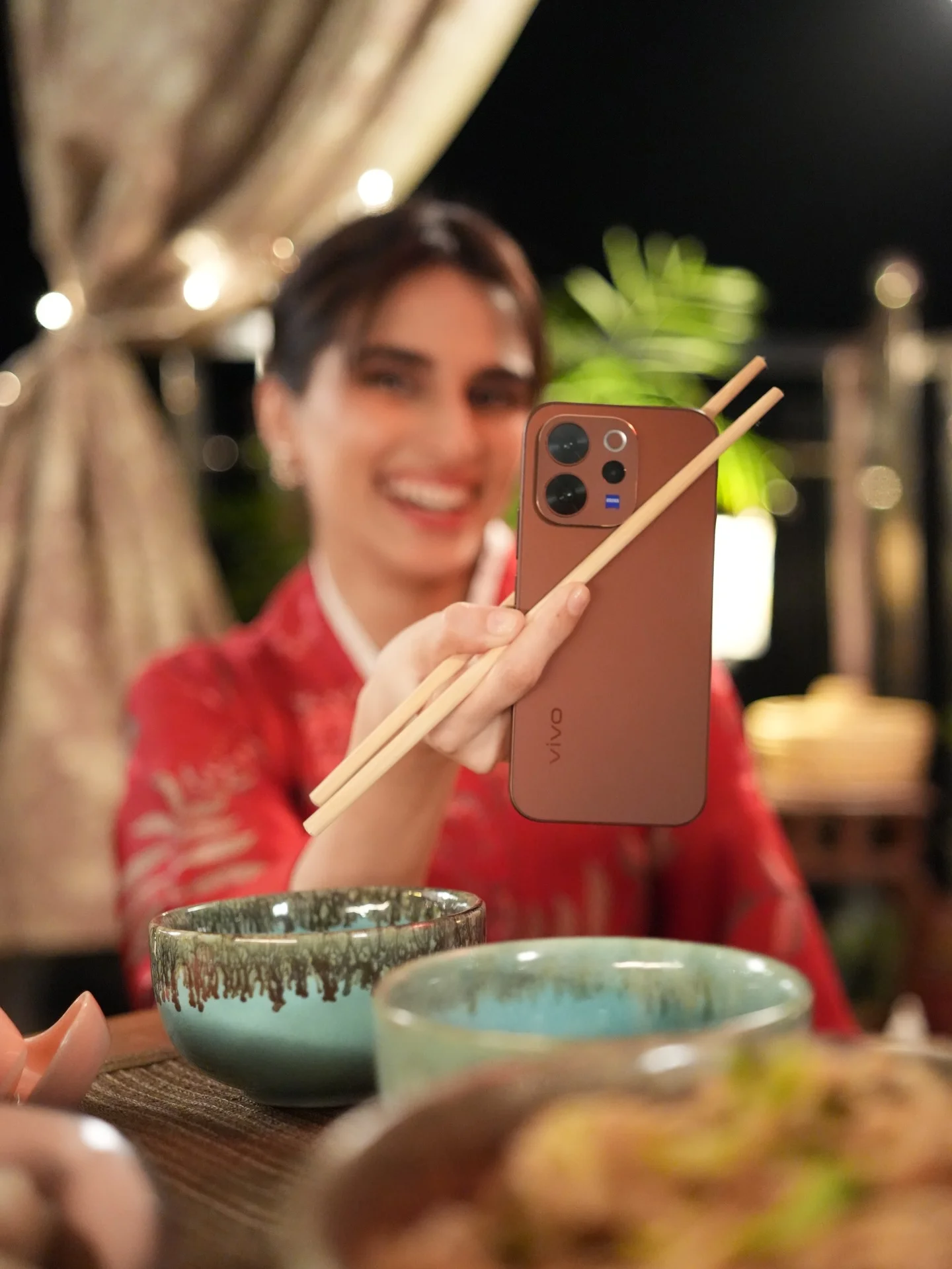 Photo by Aisha Ahmed 🦩 on February 13, 2026. May be an image of phone, sushi, chopsticks, tablet and text.