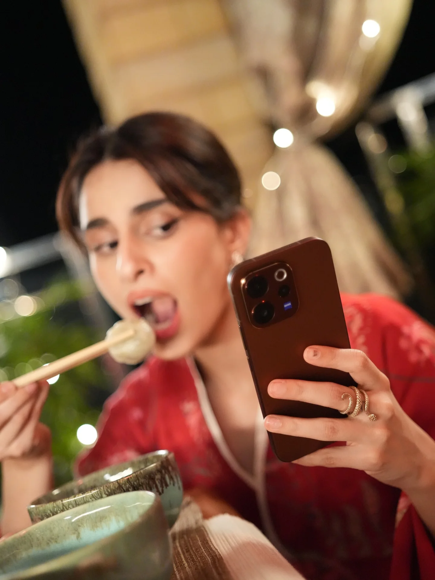 Photo by Aisha Ahmed 🦩 on February 13, 2026. May be a selfie of sushi, phone, chopsticks, bath robe and text.