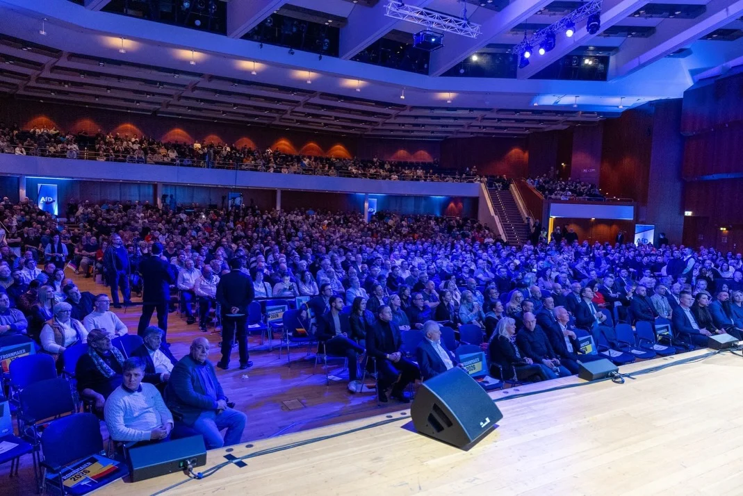 Photo by Alice Weidel on February 13, 2026. May be an image of crowd and text.