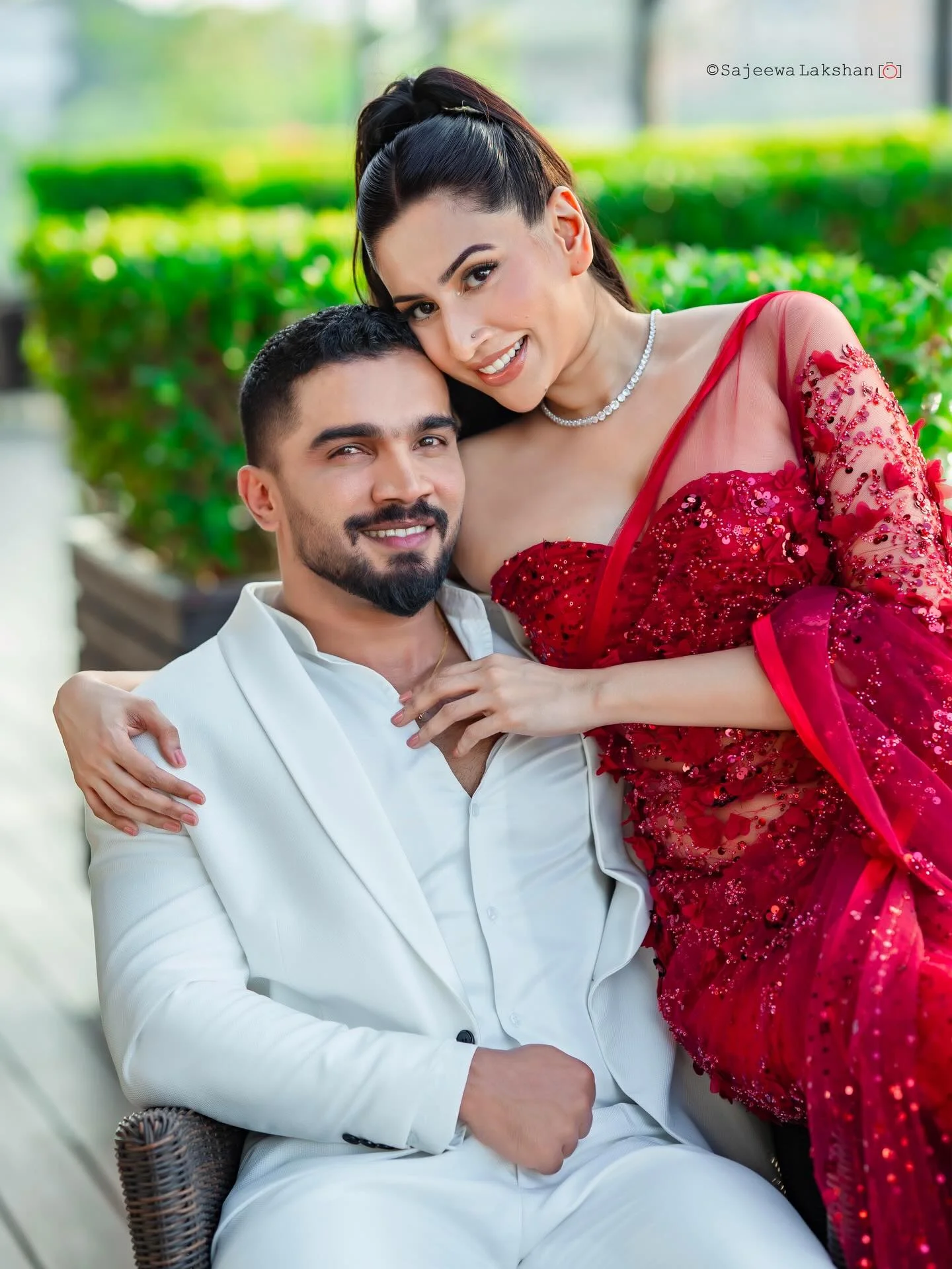 Photo shared by Amanda Silva on February 14, 2026 tagging @tanash_by_thimani, @diaswanigasekara, @sajeewa_lakshan, @groomsartsl, @harshana_senanayake__, and @amanda_dias_official. May be an image of one or more people, beard, makeup, people smiling, dinner jacket, dress, wedding, outdoors and text.