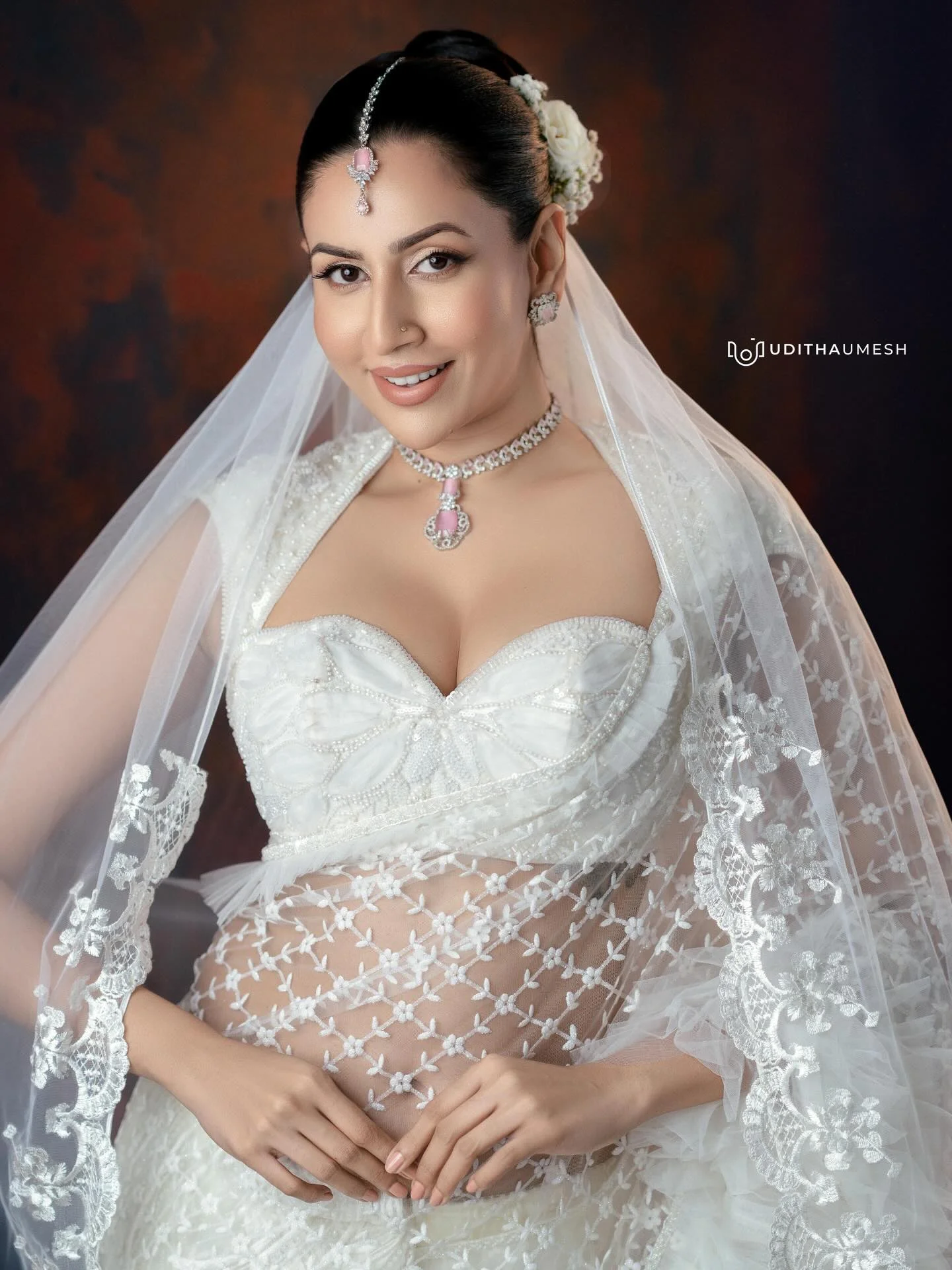 Photo by Amanda Silva on March 21, 2026. May be an image of one or more people, makeup, gown, wedding and text.