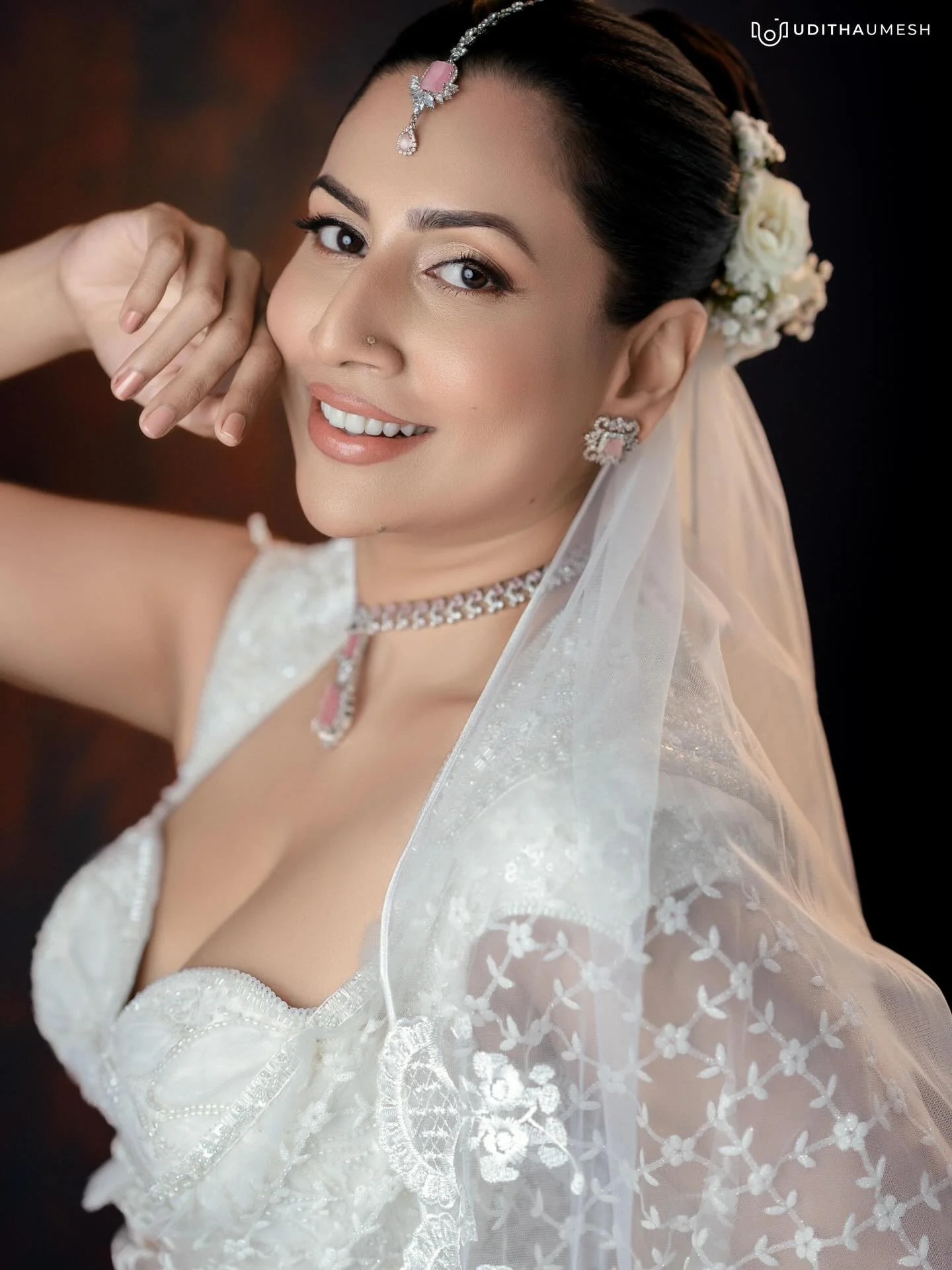 Photo by Amanda Silva on March 21, 2026. May be an image of one or more people, makeup, hair, dress, wedding and text.