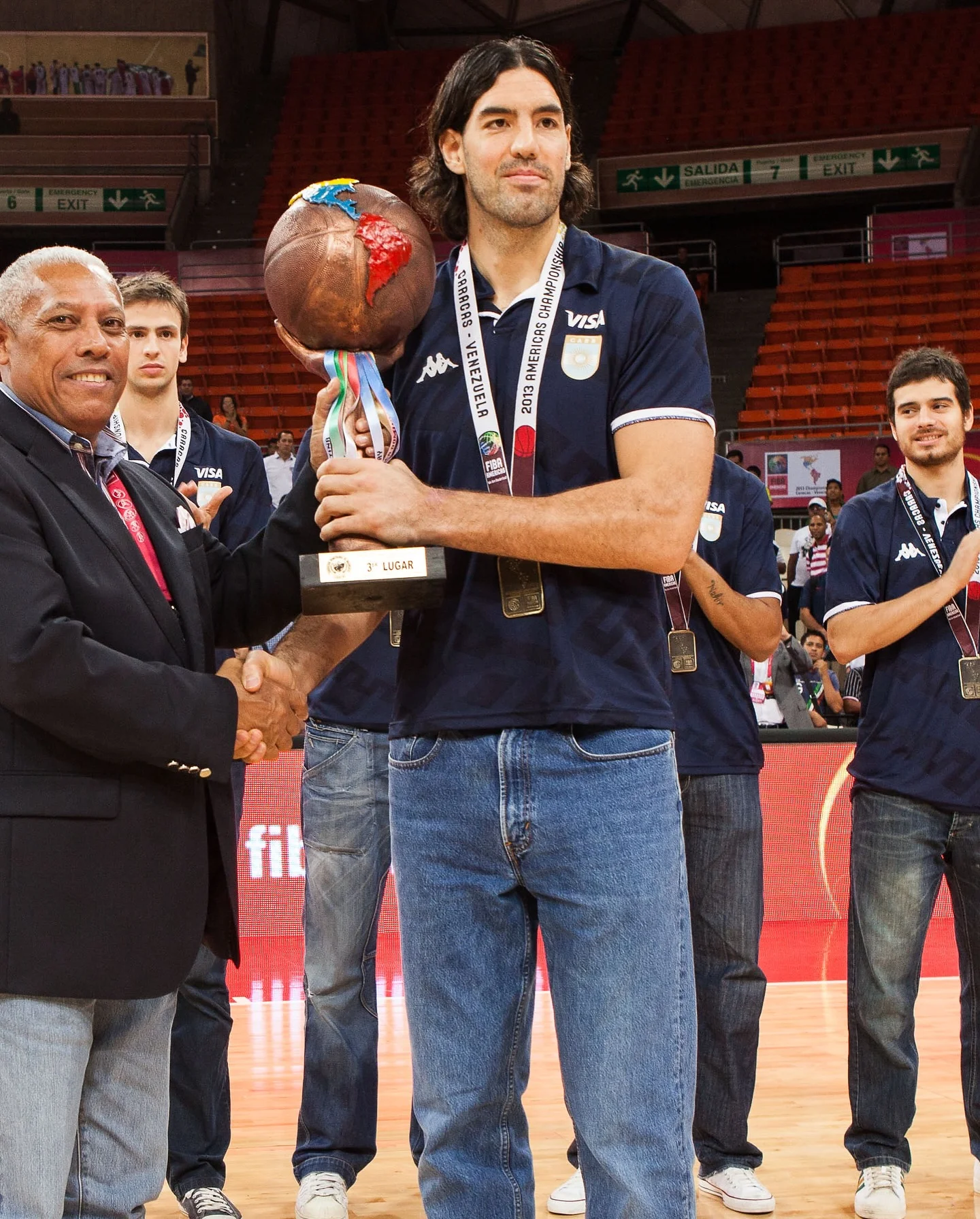 Photo by FIBA AmeriCup on March 25, 2026. May be an image of basketball, football and text that says 'SBRACAS CHAMPIONS VISA VENEZUELA ERICO รพ ειστ VISA GOR e) LUGAR 1SA fil'.
