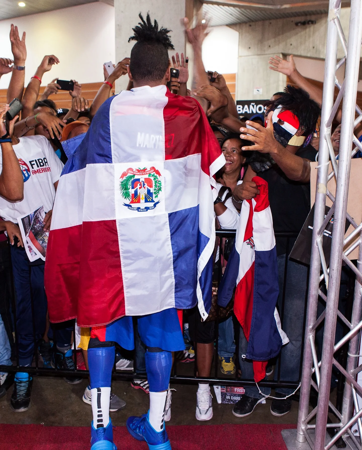 Photo by FIBA AmeriCup on March 25, 2026. May be an image of flag, crowd and text.